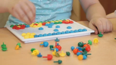 Child plays the intellectual educational game Stock Footage 64804008