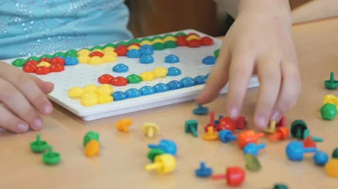 Child plays the intellectual educational game Video stock 65316822