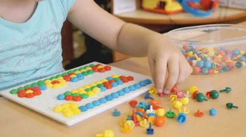 Child plays the intellectual educational game Video stock 65769070