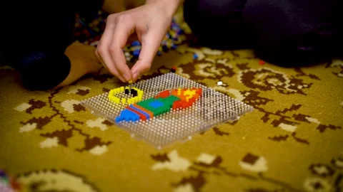 Child plays the intellectual educational game. child puts the puzzle. Children's Stock Footage 149004072