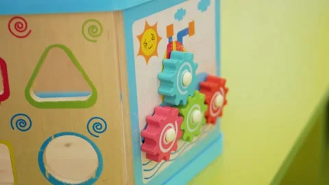 Child plays with interactive toy, educational, children's play center Stock Footage 171874796