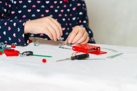 Child plays with iron constructor Stock Photos