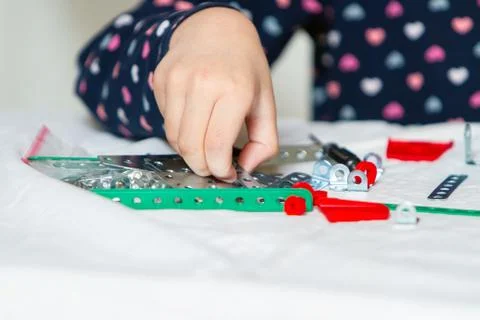 Child plays with iron constructor Stock Photos
