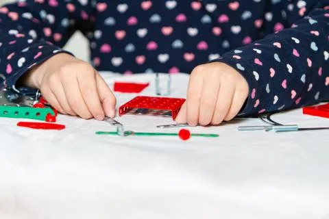 Child plays with iron constructor Stock Photos