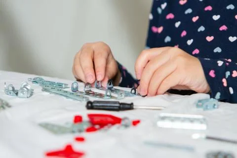 Child plays with iron constructor Stock Photos