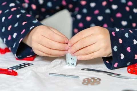 Child plays with iron constructor Stock Photos