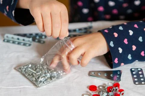 Child plays with iron constructor Stock Photos