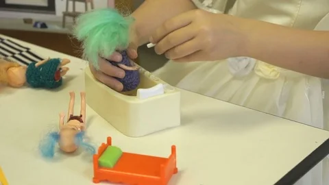 The child plays in kindergarten indoors Stock Footage