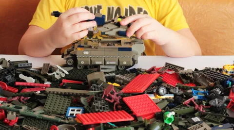 The Child Plays With LEGO 3 Stock-Footage 48065366
