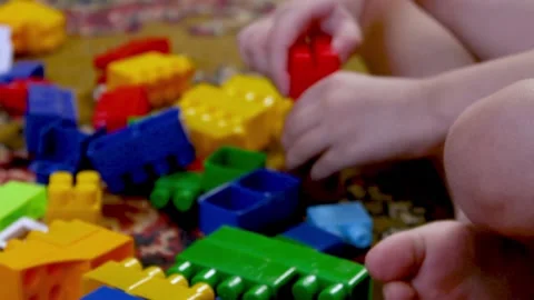 The child plays with multi-colored cubes. Weekend children at home. Stock Footage 239239544
