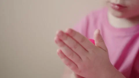 Child plays with pink clay in simple indoor activity for creativity and fun Stock Footage 341504195