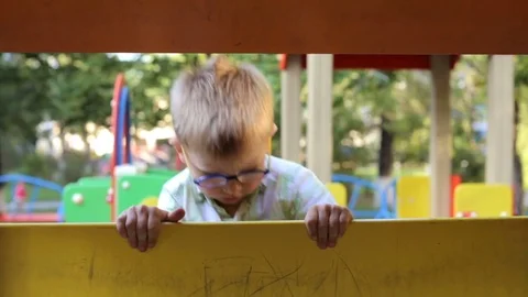 A child plays on the playground Video stock 78862000