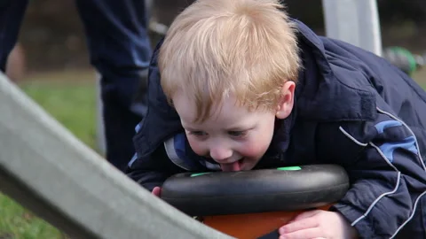 Child plays in a playground Stock Footage 145231859
