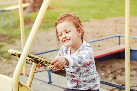 The child plays on the Playground Stock Photos