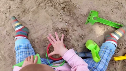 A child plays with the sand. Stock Footage 276282011