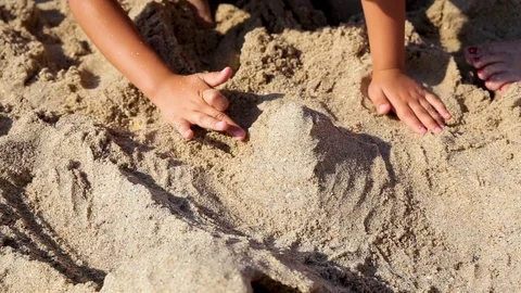 The child plays with sand on summer beach. Stock Footage 112783270