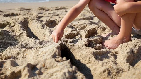 The child plays with sand on summer beach. Stock Footage 113471830