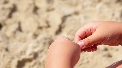 The child plays with sand on summer beach. Stock Footage 113703320
