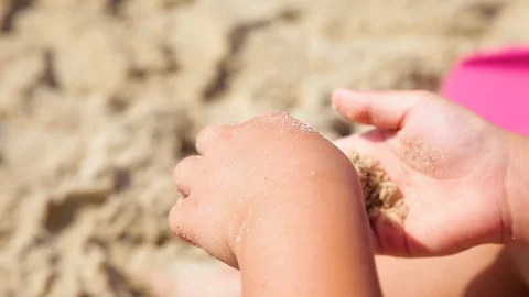 The child plays with sand on summer beach. Stock Footage 113703350