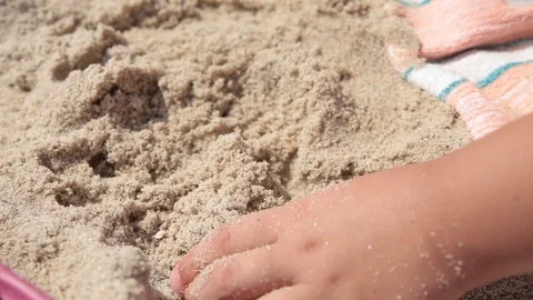 The child plays with sand on summer beach. Stock Footage 113703397