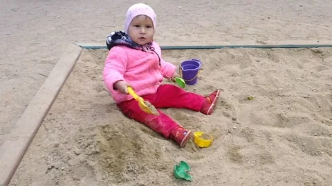 A child plays in a sandbox Stock Footage 91218979