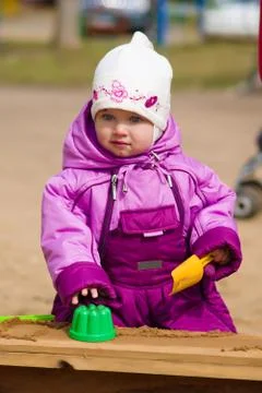 Child plays in sandbox Stock Photos
