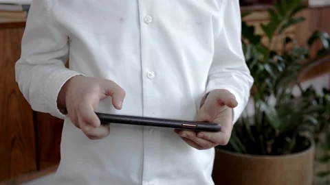 The child plays a smartphone. Close-up on hands. Addiction to games. Stock Footage 148144713