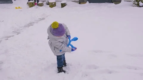 Child plays with snow. Selective focus. Stock Footage 261139055