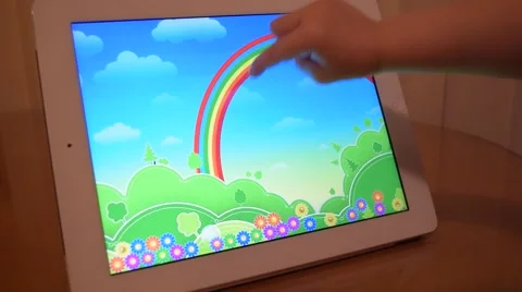 Child plays on a tablet computer 스톡 동영상 60223319