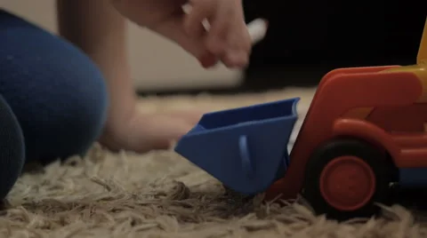 Child plays with a toy Video stock 42320498