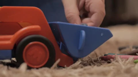 Child plays with a toy Stockbeeldmateriaal 42320548
