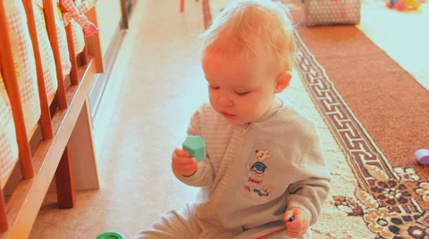 A child plays with toys Stock Footage 46939701