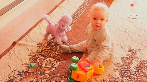 A child plays with toys Stock Footage 46943335