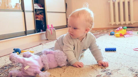 A child plays with toys Stock Footage 46971058