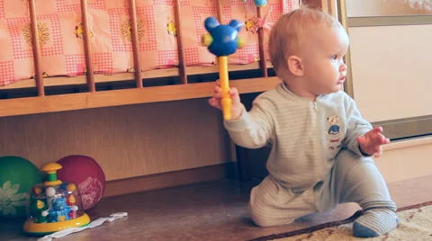 A child plays with toys Stock Footage 46971207