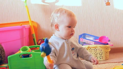 A child plays with toys Stock Footage 46971232