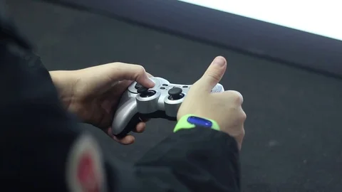 Child plays using modern gamepad Stock Footage 73011410