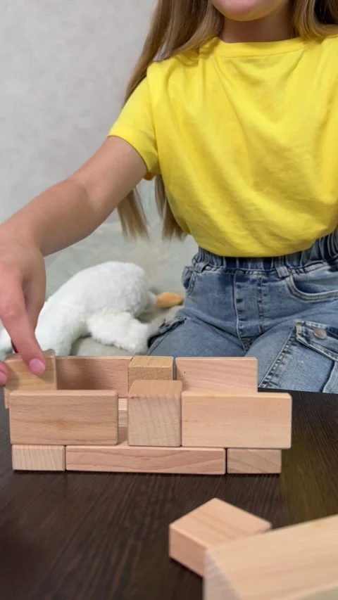 The child plays using wooden cubes, Stock Footage 244656738