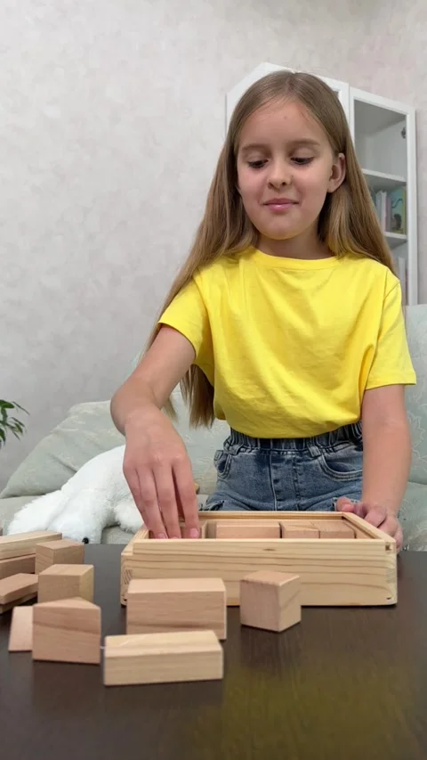 The child plays using wooden cubes, Stock Footage 244656782
