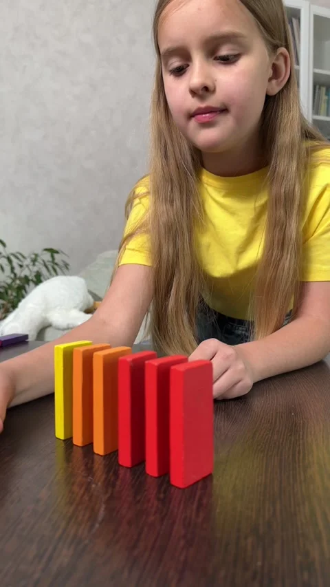 The child plays using wooden cubes, Stock Footage 244656810