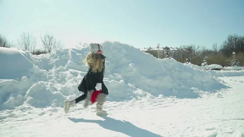 Child plays in the winter Park Stock Footage 87841324