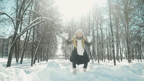 Child plays in the winter Park Stock Footage 88153189