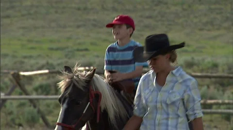 Child on Pony Ride Horse 5 59.94 Stock Footage