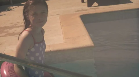 Child by pool, lens whacked in camera and in slow motion Stock Footage 40101622