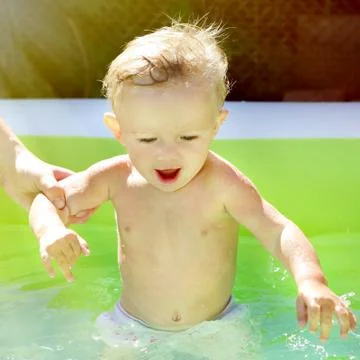 Child in the Pool Stock Photos
