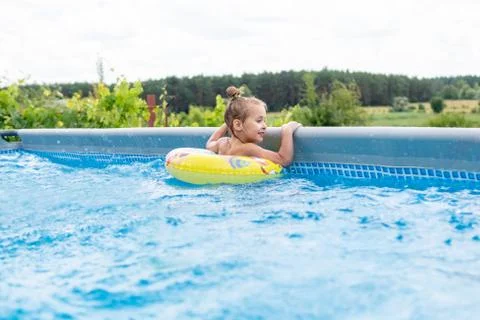 Child at the pool side Stock Photos