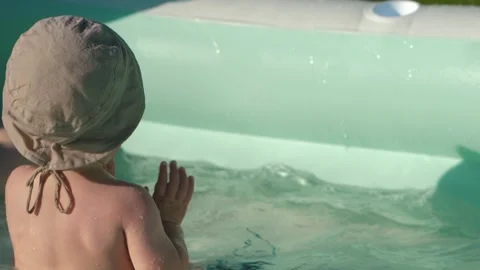 Child in the pool, slow motion Stock Footage 323568449