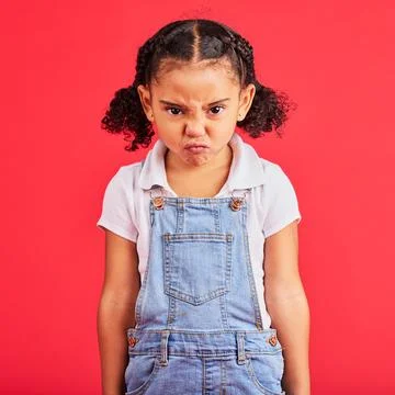 Child, portrait or angry face on isolated red background in emoji tantrum Stock Photos