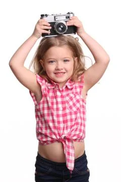 Child posing with a camera. Close up. White background Stock Photos