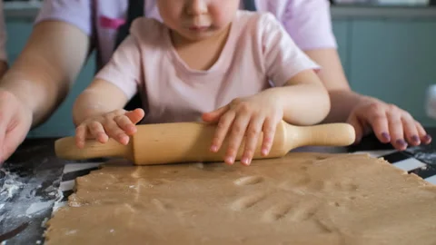 Child practicing rolling ginger cookie dough Stock Footage 321952128